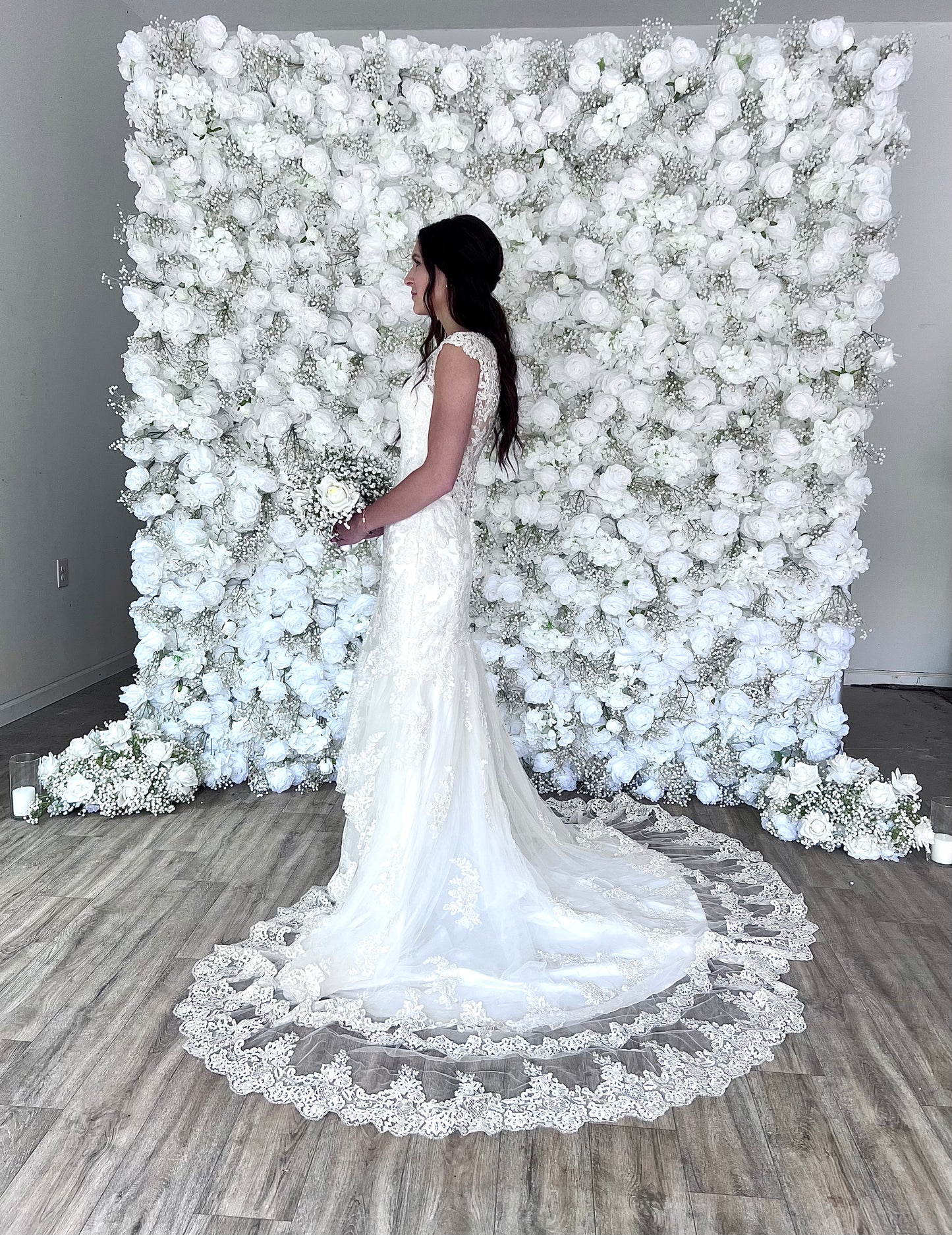 The Aveline Flower Wall Backdrop is made from beautiful white roses and babys breath.