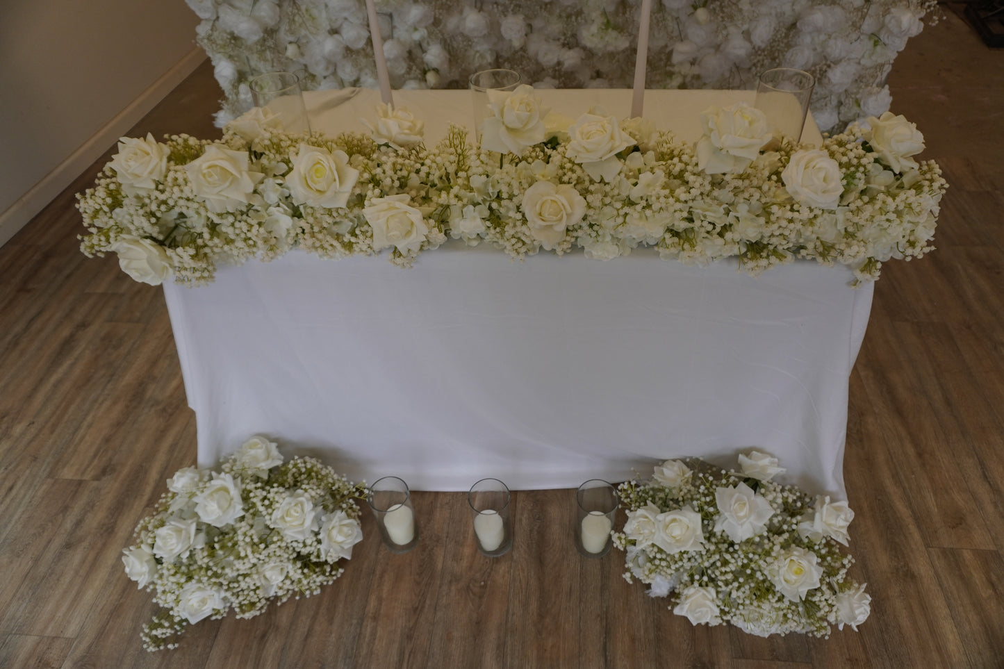 white rose and babys breath wedding table decorations with candles. 