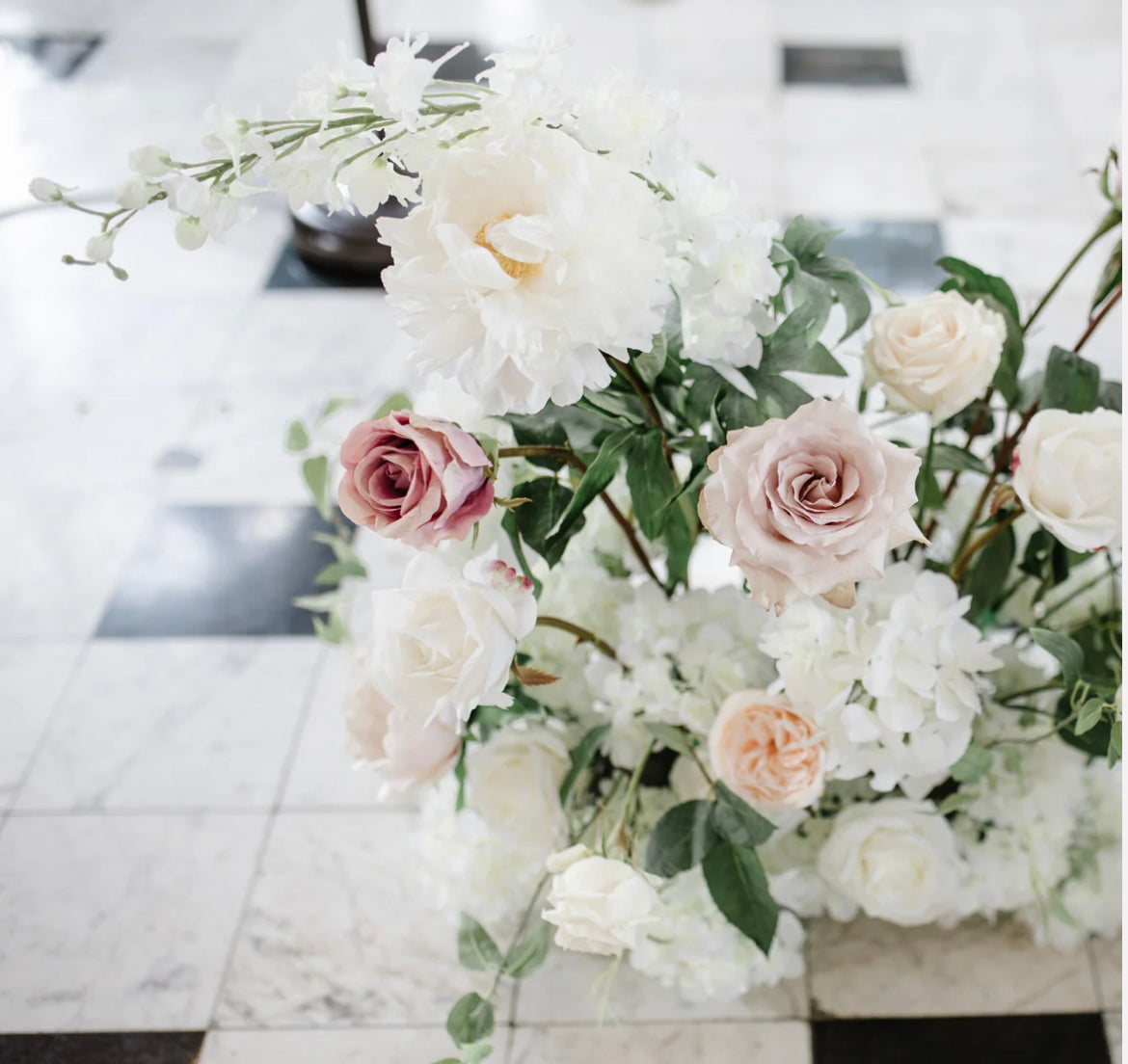 These aisle flowers are made with beautiful soft blush garden roses, ballet pink dahlias, soft blush peonies, white garden roses, white playa blanca roses, blush ranunculus, mauve roses, ivory hydrangeas, blush sweet pea's, white ranunculus, and white delphinium, with touches of eucalyptus, peach juliet garden roses, and clematis. 