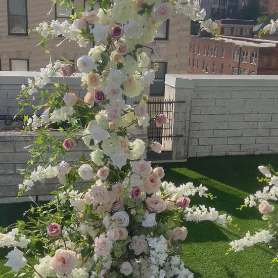 Pillars are made with beautiful soft blush garden roses, ballet pink dahlias, soft blush peonies, white garden roses, white playa blanca roses, blush ranunculus, mauve roses, ivory hydrangeas, blush sweet pea's, white ranunculus, and white delphinium, with touches of eucalyptus, peach juliet garden roses, and clematis. 